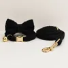 black collar+bow tie+leash