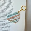 9 boucles dorées à rayures bleues