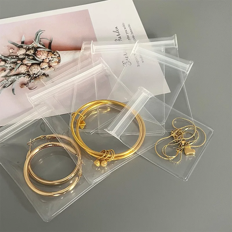 Variety of jewelry items displayed in clear EVA storage pouches