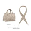 Grayish-brown diamond-shaped underarm shoulder strap