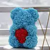 thin blue bear with red heart with box