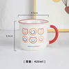 Red handle with a smiley bear face