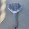 Cepillo quitapelusas tipo C, gris