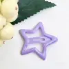 Clip estrella gota de aceite color 3.2cm violeta