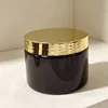 Black bottle with gold lid