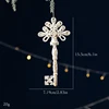 Ornement de Noël clé en ton or blanc (1 pièce)