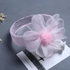 Rosa con bordi sfrangiati e pompon