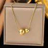 Collana con sfere grandi e piccole in oro h331