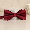 Short bow tie on red wine surface