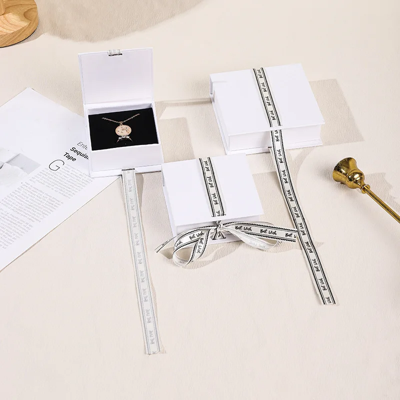 A1 New Product Ribbon Magnet Flip Jewelry Box Luxury Jewelry Packing Ring Watch Necklace Earring Gift Packing Box With Logo supplier