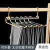 6 percheros para pantalones negros y dorados