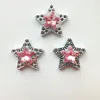 14#: stella a cinque punte con diamante rosa