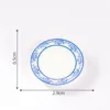 Sei grandi piatti rotondi smaltati in blu e bianco vivaci