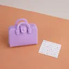 Purple bag + sheet music
