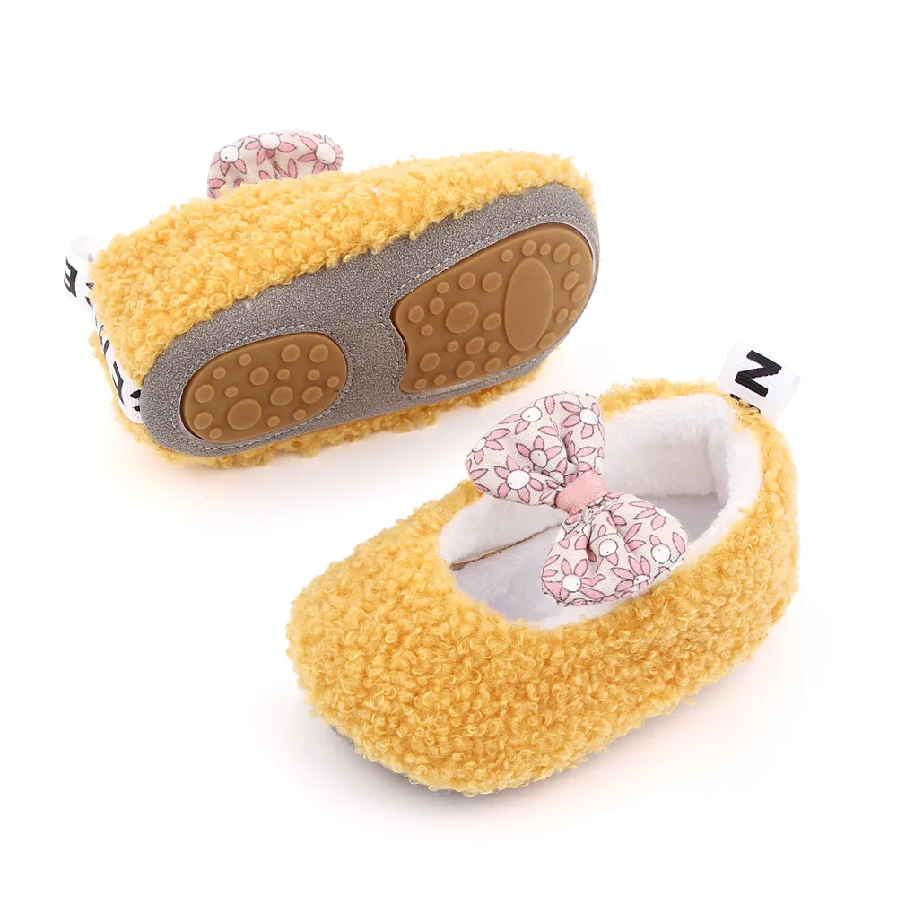 Autumn and Winter 0-1 Year Old Baby Solid Color Fluffy Cute Bow Warm Soft Soled Cotton Shoes supplier