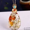 Collana pendente ambra fiore naturale in argento sterling 925
