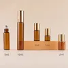 Amber bottle + steel roller ball + gold aluminum cap