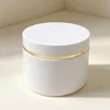 White bottle with hot gilt edge and white lid