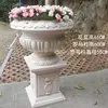 Vaso da fiori extra-large a forma di zucca con colonne romane.