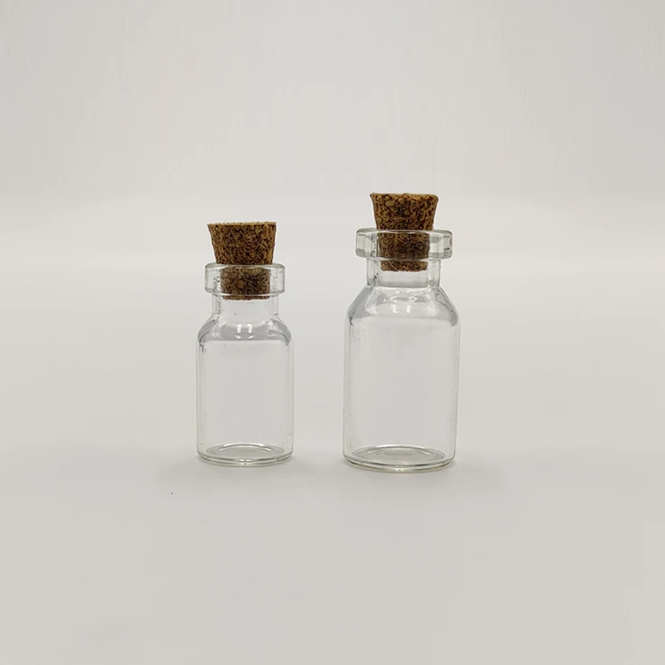 Wholesale mini wishing bottle 5ml 10ml 15ml 20ml 25ml glass vials Custom Logo Clear Glass Match Storage Jar with cork stopper