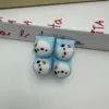 Quadrato cucciolo a quattro bottoni