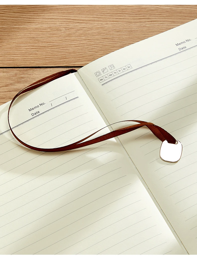 Promotional high-end a5 notebook supports fully customized business notebook high value customized logo with metal pendant books