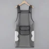 Black, regular style, with a pocket for wiping hands.