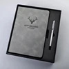 Black notebook with pen