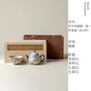 Chat orange caramel-imitation bambou gris-poire pot fleur bouche