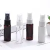 amber bottle with black sprayer