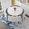 Mesa redonda con estampado floral + cuero gris claro y blanco