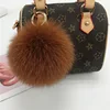 Brownish-yellow fox fur ball 12cm