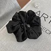 1 Black hair tie with bow
