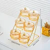 6 glass discs, amber-colored staircase, gold-plated support