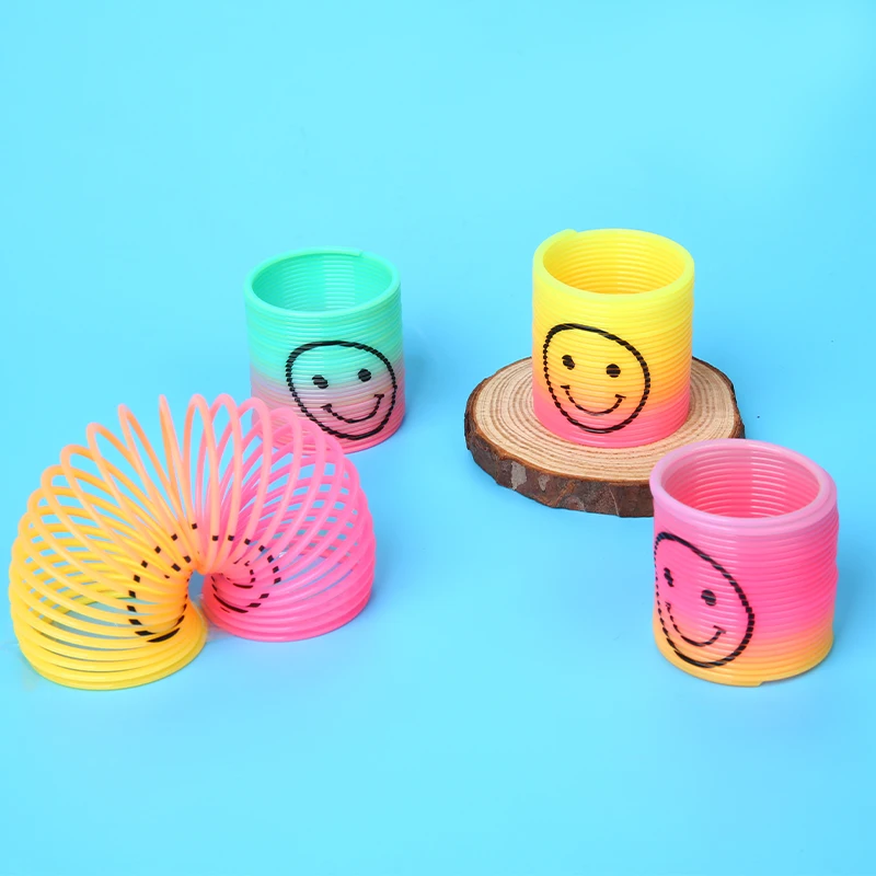 Оптовая продажа, Классическая новинка, игрушка для детей, отличные сувениры для вечеринок, большой размер, мини-размер, улыбающееся лицо, принт, красочная Волшебная Радуга, пружина