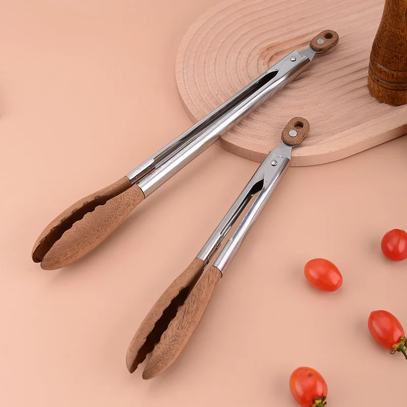 Hot Sale Stainless Steel Walnut Olive Wooden Kitchen BBQ Spaghetti Meat Garlic Clip Fry Food Tongs With Wood Lock manufacture