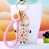Tortue rose + corde porte-bonheur rose