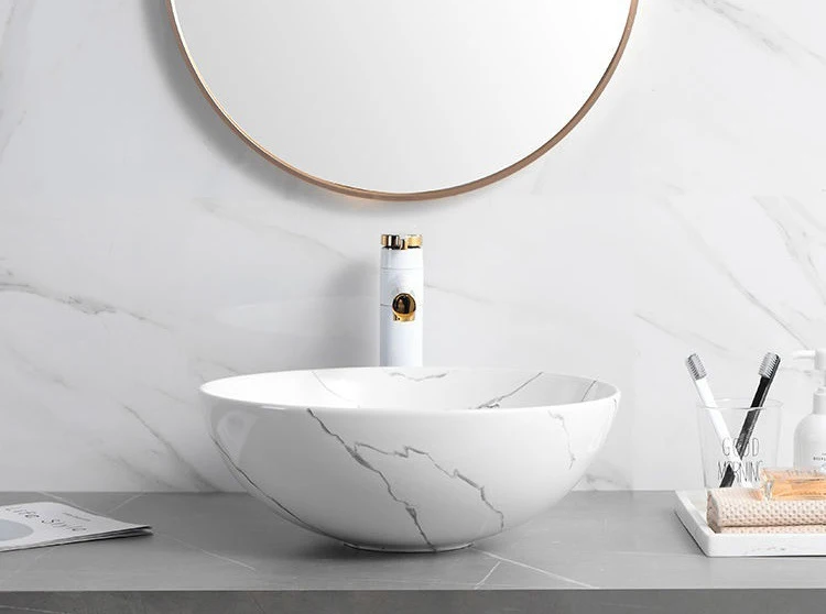 Calacatta white marble washbasin ceramic art basin hotel home bathroom oval hand wash basin sink supplier