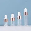 Clear glass bottle + gold ring + white silicone tip