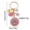 Llavero con placa de letra "Mamá" en forma de estrella, color rosa dorado, para el Día de la Madre, con perla - 132g