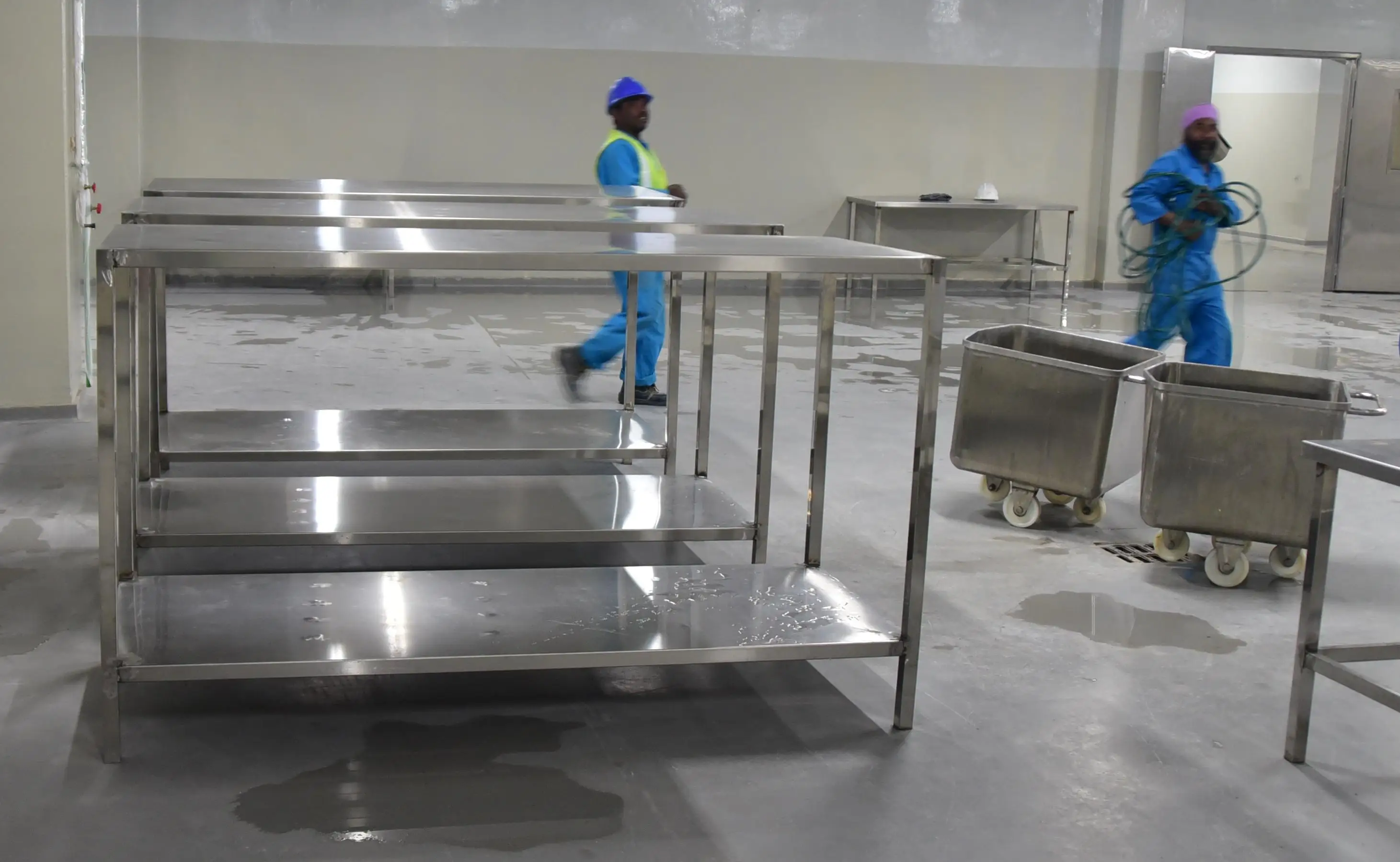 Factory stainless steel work table for use in slaughterhouse or meat processing line