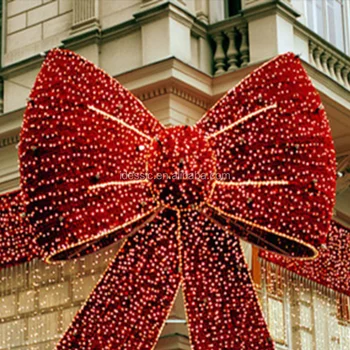 large lighted red bow