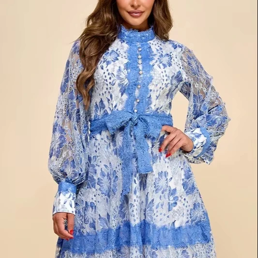 A Short Blue Lace Dress With Blue And White Lace Trim - Image 1