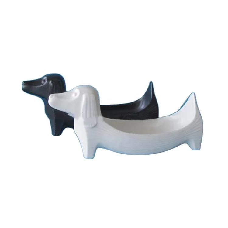 white porcelain dog figurines