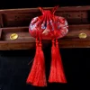 Grande borsa vuota con fiore rosso luna e doppia nappa
