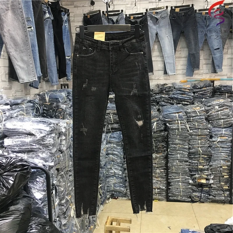 Lady Jean Woman Ripped Jeans Stock 