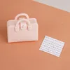 Light pink bag + sheet music