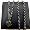 Dice and anchor pendant with letter chain