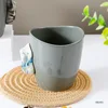 Grey cup with blue handle