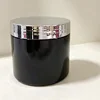Black bottle with silver lid